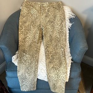 The platinum jeggings by Chicos size 1.5 or 10. Gold animal print with sparkles.